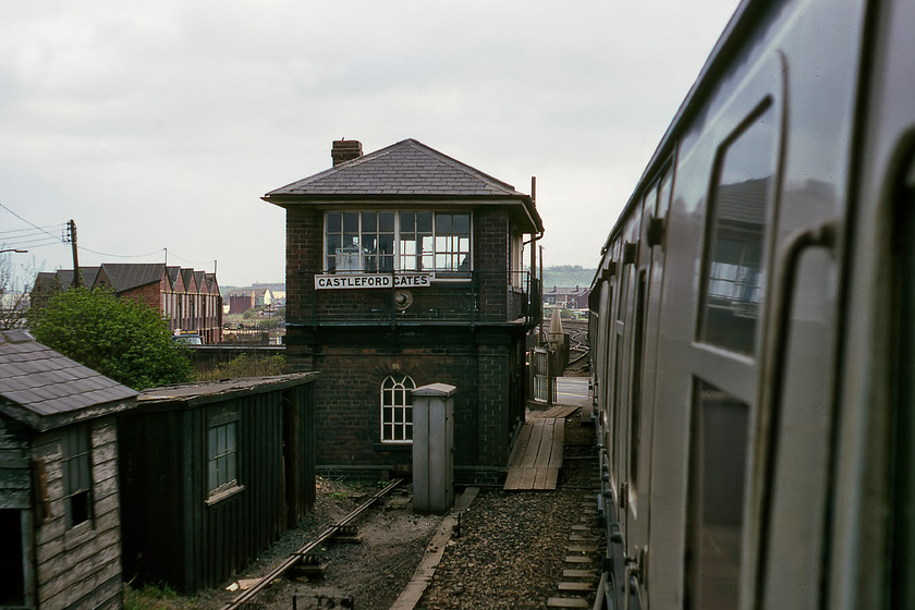 Castleford Gates Signal Box (NE, c1870) 
 As our train passes through Castleford at some speed, I managed a bit of a 'grab shot' of Castleford Gates signal box. This NER box dates from circa 1870 built to its Type S1 design. It soldiered on in use until 1987 when it was closed by Railtrack along with Whitwood and Castleford Station boxes. Control was moved to a portacabin affair diagonally opposite Gates box. I last visited this area in 2018 during the 'Beast from the East' extreme weather event and found the box still standing but looking very sorry for itself, see..... https://www.ontheupfast.com/p/21936chg/23791609604/castleford-gates-signal-box-ne-1870 
 Keywords: Castleford Gates Signal Box NER North Eastern Railway