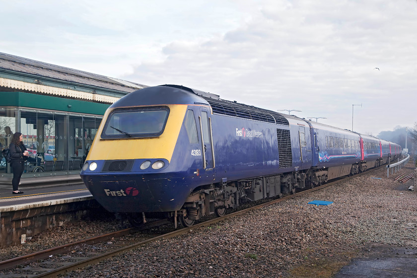 43183, GW 10.00 London Paddington-Paignton (1C09, 3E), Chippenham station 
 43183 brings the 10.00 Paddington to Paignton via Bristol TM service into Chippenham station. This 1C09 is an unusual working as it travels via the GWML rather than the more usual Berks and Hants route. 43183 was a late power car introduced for the HST125 NE/SW cross-country services in 1982 being part of set 243051. The picture is taken from the truncated end of the redundant but largely intact old platform 1 that had its track removed in early 1976. 
 Keywords: 43183 1C09 Chippenham station