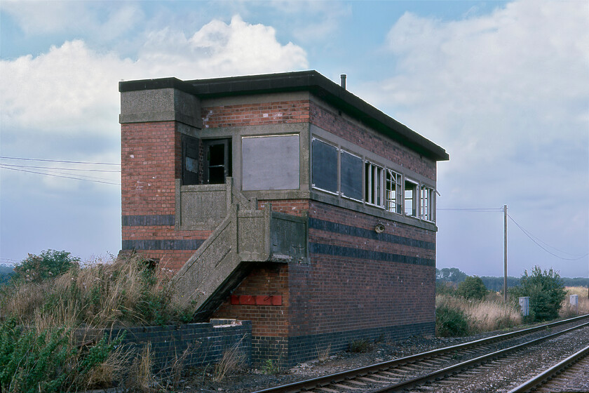 Queniborough Signal Box (LMS, 1941) 
 The derelict Queniborough signal box is seen just a short distance northeast of Sytston Junction. It was constructed by the LMS in 1941 when the nearby munitions factory was expanded and in full production as part of the war effort. It is a utilitarian ARP-style concrete and brick structure designed to be blast-proof. Sometime after the war, it was closed giving it a very short working life. 
 Keywords: Queniborough Signal Box LMS