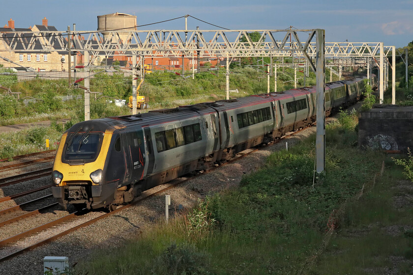 221103 & 221104, VT 19.02 London Euston-Holyhead (1D93, 20L), site of Roade station 
 It is almost a repeat of the previous photograph taken at the site of Roade's former station but this time it's sequentially numbered 221103 and 221104 working the very late running 19.02 Euston to Holyhead service. I read that the end of the Voyagers on this line may now not actually be taking place as Grand Union have applied to run trains between London and Stirling using off-lease 221s and Class 222 Meridians. Can you imagine making a journey in its entirety on one of these units? 
 Keywords: 221103 221104 19.02 London Euston-Holyhead 1D93 site of Roade station AWC Avanti West Coast Voyager