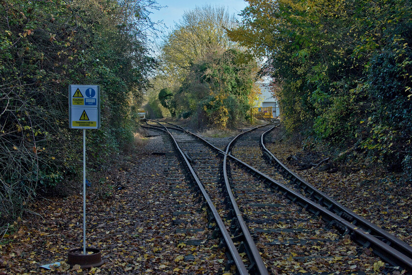 Geismar (UK) test facility, Mid. route to Bedford, Brackmills 
 The message is clear, Mike and I should walk no further along the former Northampton to Bedford line here in the Brackmills Industrial Estate! This is the only section of track still laid and in use on this route is being used by Geismar (UK) for testing of their railway plant equipment. A few years ago the company used the entire section of the remaining track between here and Claughton Road in Northampton where track panels were taken for onward transportation. This facility eventually closed on December 2005 so with the track now serving no further purpose it was lifted and the level crossing over Brackmills' Buryport Road removed. With continued and sustained efforts to revive the Northampton to Bedford route one wonders if 'proper' trains will ever pass this spot again; not in my lifetime, I suspect! 
 Keywords: Geismar (UK) test facility Midland route to Bedford Brackmills