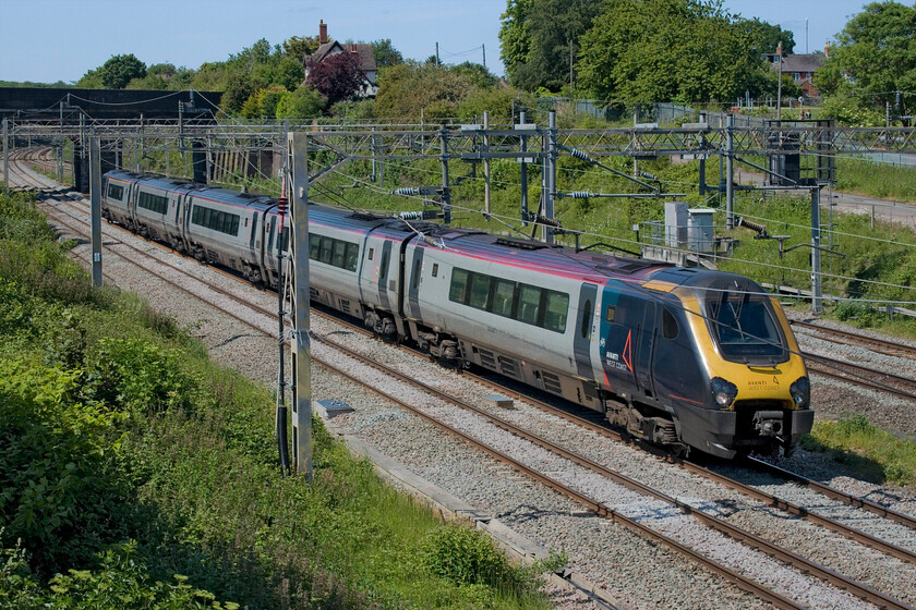 221107, VT 13.32 Chester-London Euston (1A33, RT), site of Roade station 
 A single set Voyager in the form of 221107 passes the site of Roade station working the 13.32 Chester to Euston Avanti West Coast service. The days of these tired units operating such services are strictly numbered now with the testing of their replacements, the bi-mode A-Trains underway but software problems (or the like) will probably delay their introduction as is usually the case! 
 Keywords: 221107 13.32 Chester-London Euston 1A33 site of Roade station AWC Avanti West Coast Voyager