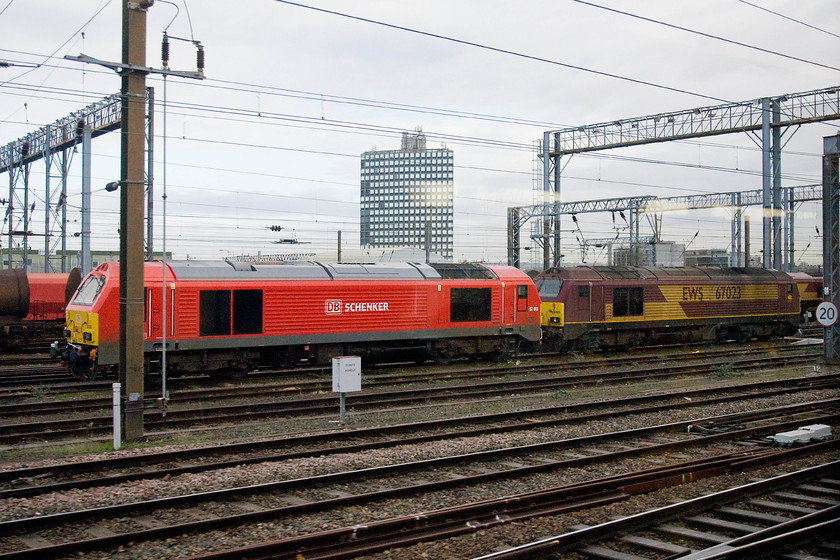 67013 & 67023, stabled, Wembley yard 
 Striking quite a pose in its new DB livery is 67013 stabled in Wembley yard. By comparison, 67023 sits behind it in the EWS livery that now looks somewhat dated and drab. 
 Keywords: 67013 67023 stabled Wembley yard