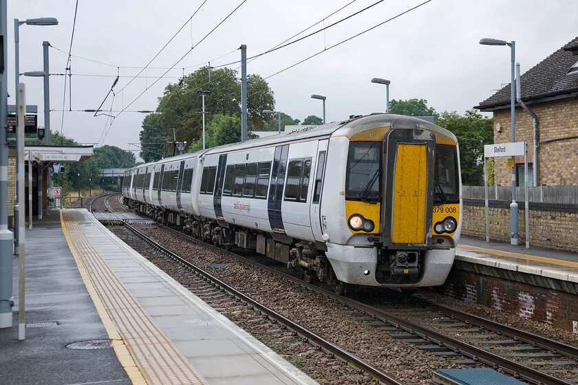 379008, LE 09.28 London Liverpool Street-Cambridge (2H16), Shelford station 
 378008 passes through Shelford station with the 09.28 Liverpool Street to Cambridge service. The Electrostar units entered service some three years ago on this route and have proved to be a major success improving the travelling experience of passengers between London and Cambridge. 
 Keywords: 379008 09.28 London Liverpool Street-Cambridge 2H16 Shelford station Abellio Greater Anglia