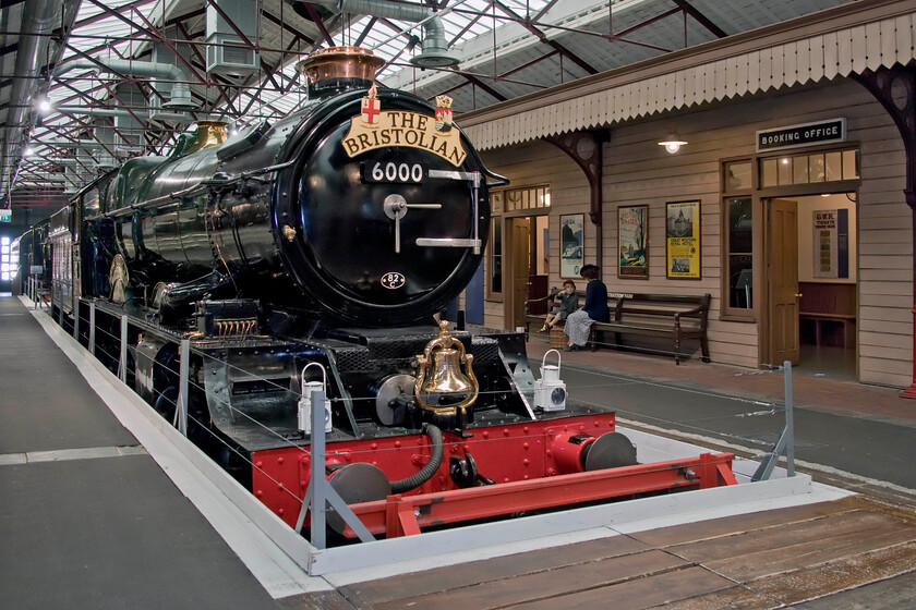 6000, on display, Steam museum, Swindon 
 The King looks absolutely superb on display in Swindon's Steam museum. It has been there for a number of years but may possibly see some further use on preserved lines. However, use on the mainline (particularly the tracks of the Western Region) would be impossible without modifications to reduce the height of the chimney, the cab and the safety valve bonnets by about four inches. Notice the bell that is carried by 6000. This is in commemoration of its visit to the USA just three months after it was introduced but prior to it entering revenue earning service in 1927. 
 Keywords: 6000 on display Steam museum Swindon