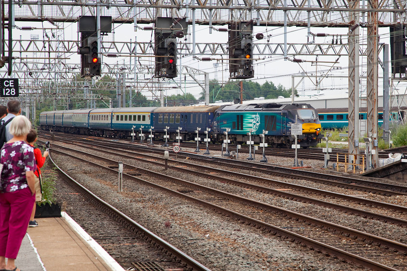 68016, 14.35 Crewe HS-Crewe ECS (for 15.35 Crewe-London Euston, via Chester, 1Z19), Crewe station 
 Crewe station was packed for most of the day as some of the 4 000 visitors to the DRS Open Day at Gresty Bridge took the opportunity to undertake some spotting at the station. The set of ex. BR Mk.II stock, having been serviced in the carriage sidings, is brought back into Crewe station by 68016 'Fearless'. This would then form the 1Z19 15.35 back to London Euston carrying many enthusiasts returning from the Open Day. No doubt they would spend their time comparing notes, scrolling through their digital images and eating rather dried up cheese sandwiches! 
 Keywords: 68016 ECS 1Z19 Crewe station