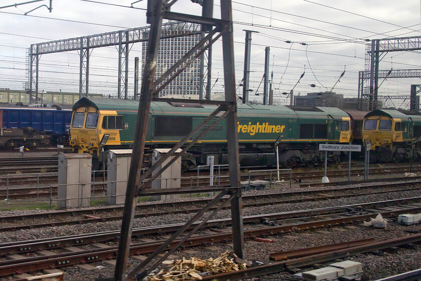 66506 & 66603, stabled, Wembley Yard 
 Wembley Yad was almost devoid of locomotives when we passed on our train on this Friday morning. I managed to capture 66506 and 66603 stabled between duties at Sudbury Junction with a hidden and unidentified EWS example tucked in behind. 
 Keywords: 66506 66603, stabled Wembley Yard Freightliner