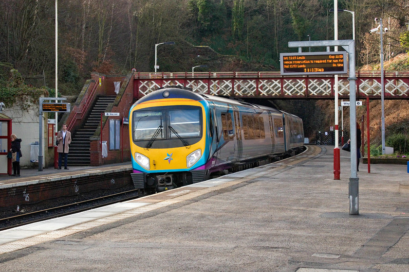 185150, TP 09.56 Liverpool Lime Street-Scarborough (1E31, 3L), Morley station 
 TPE's 185150 passes through Morley station with the 09.56 Liverpool to Scarborough working. It has just emerged from 1.9 mile long Morley tunnel the portal of which can be seen in the background. 
 Keywords: 185150 09.56 Liverpool Lime Street-Scarborough 1E31 Morley station