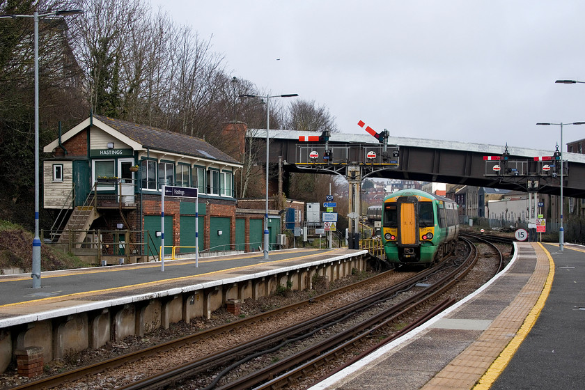 377405, SN 11.35 Brighton-Ore (1F26, RT), Hastings station 
 377405 rattles out of Hastings station past the down starter bracket working the 11.35 Brighton to Ore. This traditional scene of a mechanical box and a wonderful array of semaphores is getting very rare on the network now. When re-signalling takes place it is often stated that the ancient Victorian infrastructure is being swept away (or something similar) being replaced by modern state-of-the-art electronic systems . The issue that I have with this is that the Victorian systems have operated perfectly safely for over a century. One wonders if the new electronic system will be doing the same in a hundred years time? 
 Keywords: 377405 11.35 Brighton-Ore 1F26 Hastings station