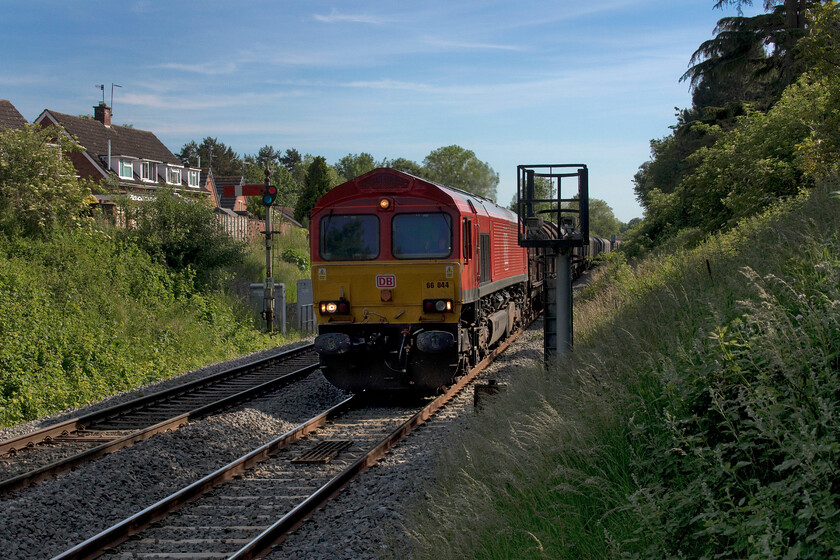 66044, 11.45 Margham TC-Round Oak (6M41, 12L), Droitwich Spa station 
 I was delighted to see 66044 creep towards me here at Droitwich Spa station leading the 6M41 11.45 Margham to Round Oak steel train. The reason for my delight was not the composition or lighting of the scene (as can be seen here!) but that this DB liveried Class 66 was a photographic cop! Notice the two large CCTV cameras mounted on the structure in front of the camera, I am not at all sure what their purpose is unless anybody can advise? 
 Keywords: 66044 11.45 Margham TC-Round Oak 6M41 12L Droitwich Spa station DB