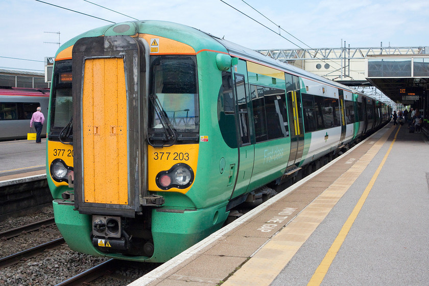 377203, SN 11.13 Milton Keynes Central-East Croydon (2O35), Milton Keynes Central station 
 With the crew having changed ends, 377203 is now getting ready to work back south as the 11.13 Milton Keynes to East Croydon. My wife and I took this train as far as Kensington Olympia; a virtually empty train! 
 Keywords: 377203 11.13 Milton Keynes Central-East Croydon 2O35 Milton Keynes Central station