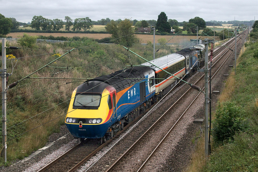 43055, 43046 & 37521, 07.14 Crewe HS-Eastleigh Arlington (5Z36, 2L), Milton Malsor SP738560 
 43055 brings up the rear of the 5Z36 07.14 Crewe HS to Eastleigh Arlington as it passes Milton Malsor just south of Northampton. Mk.III 10416 is next in the consist followed by a second HST power car, 43046, with 37521 making all the noise up at the front! The former EMR power cars, having recently been retired and been replaced on a temporary basis by some former LNER sets, are going to Arlington's facility at Eastleigh for overhaul and repainting for use in the charter market.

An audio recording of this event can be enjoyed at..... https://youtu.be/RbsW0zpMzGU . 
 Keywords: 43055 43046 37521 07.14 Crewe HS-Eastleigh Arlington 5Z36 Milton Malsor SP738560 EMR East Midlands Railway D6817