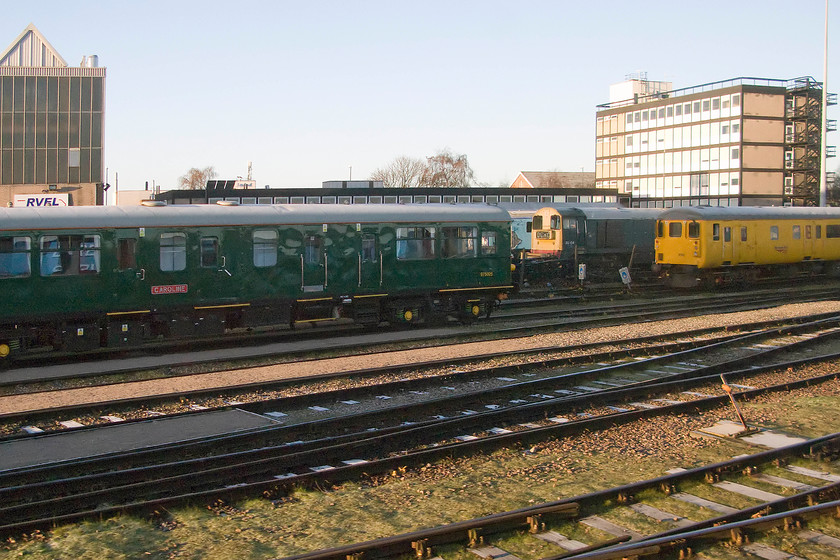 975025 & 20154, stabled, RVEL Derby 
 Network Rail observation car 975025 is seen stabled at Derby's RVEL depot. Constructed in 1958, this former trailer buffet car was built at Eastleigh as part of the narrow-body DEMU 1036. Now named 'Caroline' it is used as an observation car and can be seen all over the network usually propelled by a veteran Class 37. In the background, 20154 can be seen receiving some attention away from its home on the GCR(N) heritage railway. 
 Keywords: 975025 20154 RVEL Derby Caroline