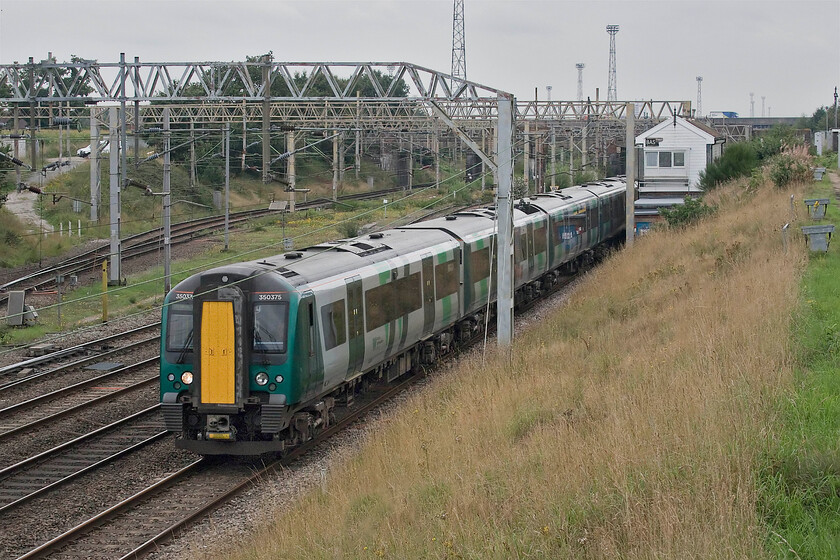 350375, LN 14.05 Liverpool Lime Street-Birmingham New Street (4G17, RT), Casey Lane SJ720519 
 Since my last visit to Casey bridge just south of Crewes Basford Hall yard in 2016 the signal box appears to have met with a mishap with most of its sign now missing, see.. https://www.ontheupfast.com/p/21936chg/25724357604/basford-hall-junction-signal-box 350375 leads another unit as they head south past the box working the 14.05 Liverpool to Birmingham New Street train. 
 Keywords: 350375 14.05 Liverpool LSime Street Birmingham New Street (4G17, RT), Casey Lane SJ720519London Northwestern Desiro