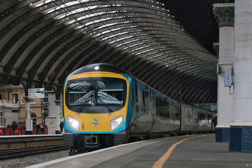 185103, TP 14.56 Liverpool Lime Street-Scarborough (1E41, 9L), York station 
 An unusual angle has been used to capture 185103 leaving York with the 14.56 Liverpool Lime Street to Scarborough service. The reason was that I was trying to replicate a shot that I took on a visit to York in 1977. Then, the subject matter was a little different but the general view has remained very similar..... https://www.ontheupfast.com/v/photos/21936chg/23615811604/x31195-stands-under-york-s-impressive 
 Keywords: 185103 14.56 Liverpool Lime Street-Scarborough 1E41 York station