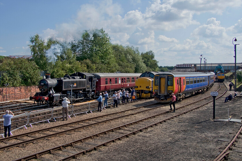 1501, shuttle train, 37610, 156498 & 66726, on display, Barrow Hill 
 Taken from the lofty height at the top of the steps of Staveley Engine Shed signal box 0-6-0 pannier tank 1501 leads a shuttle service as part of Barrow Hill's open day activities. The GWR locomotive is a visiting guest to Barrow Hill more normally found working the length of the Severn Valley Railway. Also in this view is 37610 and EMR's 156498. 
 Keywords: 1501 shuttle train 37610 156498 66726 on display Barrow Hill