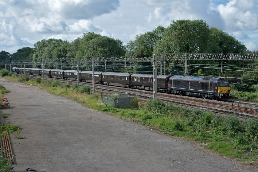 67006 & 67007, 08.48 Wolverton Centre Sidings-Scotland (1Z64), site of Roade station 
 Having departed from its home base at Wolverton Works the Royal Train passes through Roade on the down fast line led by 67006 'Royal Sovereign'. The recently repainted 67007 was bringing up the rear of the train that was travelling empty, apart from an entourage of staff, to Scotland to collect the Royal Family and take them south, via a nighttime layover in Whitemore Yard (nice!) to King's Lyn for Sandringham. 
 Keywords: 67006 67007 08.48 Wolverton Centre Sidings-Scotland 1Z64 site of Roade station Royal Sovereign