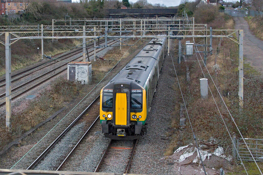 350260, LN 13.06 Birmingham New Street-London Euston (as 14.15 Northampton-London Euston) (1Y22, 1L), site of Roade station 
 It is unusual to see a single set Class 350 Desiro working a daytime London Northwestern service. 350260 is seen passing the site of Roade's former station working what was supposed to be the 13.06 Birmingham to Euston service. However, something obviously went wrong earlier as the train was re-scheduled to be the 14.15 ex Northampton that arrived just one minute adrift into Euston 
 Keywords: 350260 13.06 Birmingham New Street-London Euston 14.15 Northampton-London Euston site of Roade station