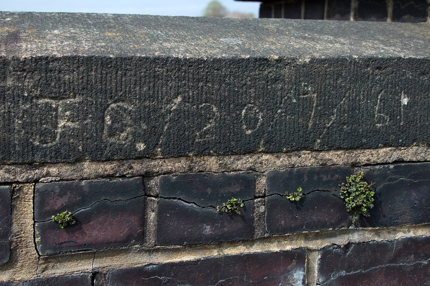 Vandalism, site of Roade station bridge 
 I would not normally include a photograph of vandalism on my site but this one is interesting! It is on the footbridge that crosses the WCML at the site of Roade station. However, one wonders if JC was a bored train spotter waiting for the next Patriot, Brittania or Duchess to pass on 20th July 1961? 
 Keywords: Vandalism, site of Roade station bridge