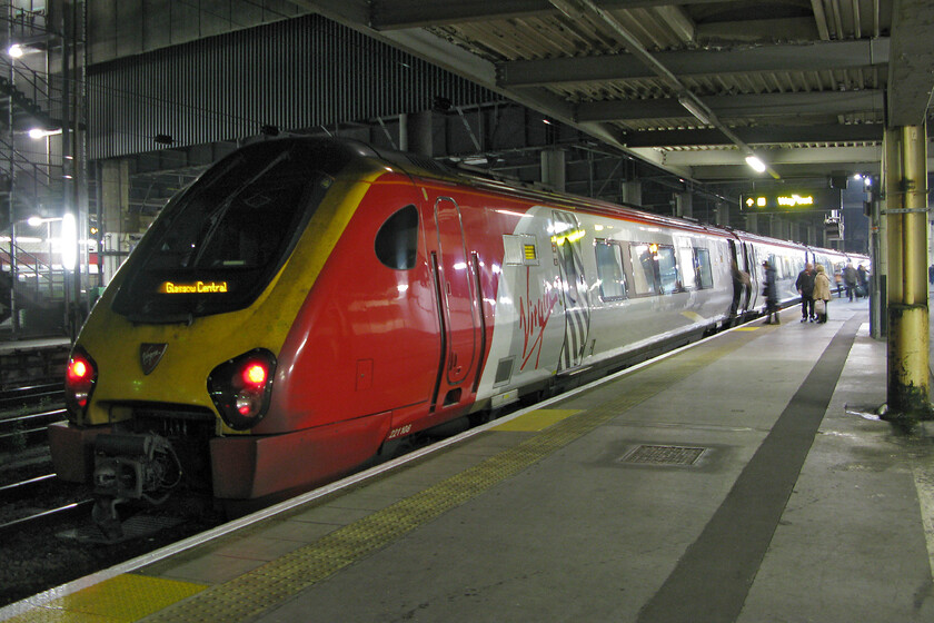 221108, 17.40 London Euston-Glasgow Central (9S97) London Euston station 
 Our train home to Milton Keynes stands at Euston just prior to departure. The 9S97 17.40 Virgin service to Glasgow Central is being worked by 221108 and is seen with passengers boarding hoping to enjoy a journey north in a noisy diesel-propelled DMU. 
 Keywords: 221108 17.40 London Euston-Glasgow Central 9S97 London Euston station