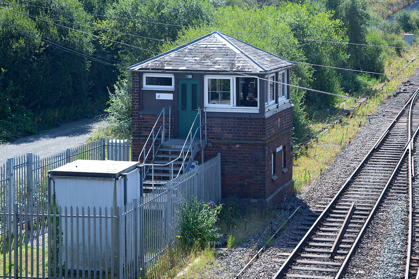 Leominster signal box (LNW & GW joint, c.1875) 
 I am not sure if Leominster is a crime hotspot, but it's such a shame that there appears to be the need to enclose a signal box inside pallisade fencing as seen here. Leominster box is another of the several LNW and GW Joint Type 1 box built c.1875. It used to be named Leominster South End as there three boxes in the station area including a huge an impressive structure on the middle platform of the station. Leominster used to be a major railway centre on the Marches line. 
 Keywords: Leominster signal box