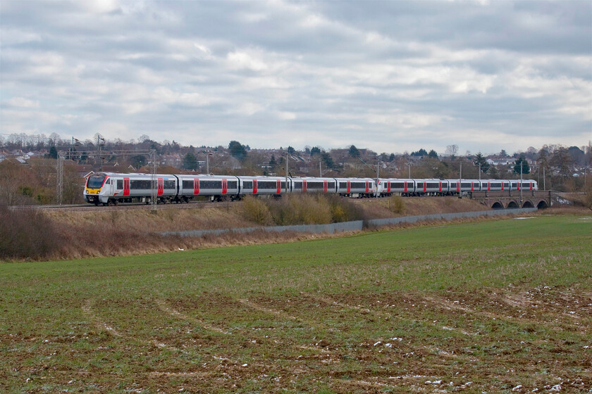 720546 & 720564, 09.45 Wolverton Centre Sidings-Rugby via Stafford (5Q27, 48L), Wilson's Crossing 
 Despite being a bitter morning with a spine chilling wind blowing from the east quite a number of enthusiasts had gathered at Wilson's Crossing just north of Northampton to witness new Abellio units 720546 and 720564 out to play on a mileage accumulation run. In this livery, they certainly brighten up the dull mid-winter scenery with Kingsthorpe in the background. On a rolling programme, all the units undertake a series of out and back test runs from Wolverton to Rugby via a reversal at Stafford, in this case running as 5Q27. 
 Keywords: 720546 720564 09.45 Wolverton Centre Sidings-Rugby via Stafford 5Q27 Wilson's Crossing Abellio Greater Anglia