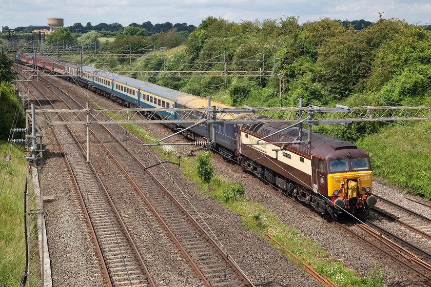 57312, 14.08 London Euston-Burton-ot-Wetmore ECS (5Z58), Victoria bridge 
 57312 'Solway Princess' brings up the rear of the 14.09 Euston to Burton-ot-Wetmore ECS move. The stock is being returned to its base at Nemesis Rail no doubt for some heavy cleaning following its use for the 3-Peaks charity event. The class 57 is painted in its smart Northern belle livery but is still owned and operated by DRS. It was new in July 1963 released into traffic as D1811. Under TOPS it became 47330, then 47390 finally reverting back to 47330 again. In 2003 it was selected to become one of Virgin's Thunderbirds and was rebuilt into 57312 ' Kyrano'. It was acquired by DRS when Virgin disposed of the standby locomotives in 2012. 
 Keywords: 57312 14.08 London Euston-Burton-ot-Wetmore ECS 5Z58 Victoria bridge