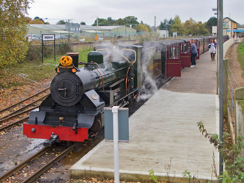 7, 15.30 Wroxham-Aylsham, Wroxham station 
 Our train back from Wroxham to Aylsham waits at the Bure Valley Railway's eastern terminus. We will soon enjoy a run back along the 15" narrow gauge line behind number 7 'Spitfire'. The Network Rail line that runs from Norwich to Sheringham via Cromer is seen in the background along with the former Wroxham signal box. Spitfire was designed and built specifically for use on the Bure Valley Railway arriving in June 1994. 
 Keywords: 15.30 Wroxham-Aylsham Wroxham station Bure Valley Railway Spitfire