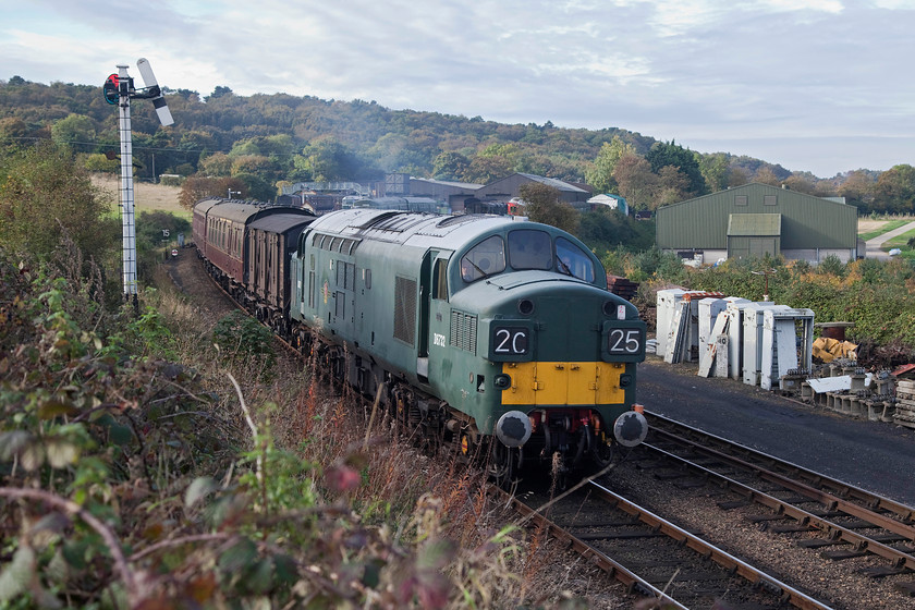 D6723, 10.35 Holt-Sheringham, Weybourne 
 A second picture of D6732 (37032) as it storms away from Weybourne with the 10.35 Holt to Sheringham. The large green building to the right is not part of the extensive yard and depot but has been built by the local farmer, and it does spoil the view somewhat. 
 Keywords: D6723 10.35 Holt-Sheringham Weybourne