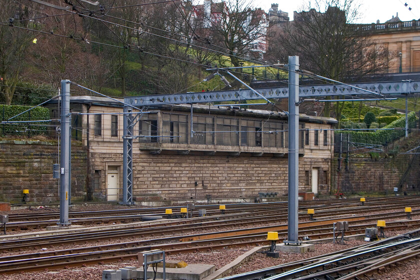 Waverley West signal box (LNER, 1936), now used by park and garden staff 
 The superb Waverley West signal box stands in a commanding position high above the tracks of the western throat of Waverley station. I have been unable to find when it was taken out of railway use but I suspect it was in the late 1980s before the arrival of electrification. It is now in use as a store and mess room for park and garden staff who look after the superb Princess Street Gardens. There is talk of it becoming a listed building that should certainly be given its 1936 LNER heritage.

NB the celebrated historian, railway enthusiast and TV presenter Tim Dunn has joined the calls for the box to be put to better use, see..... https://www.edinburghnews.scotsman.com/news/transport/first-look-inside-abandoned-signal-box-with-best-views-of-edinburgh-3506277 (added 2024) 
 Keywords: Waverley West signal box LNER now used by park and garden staff