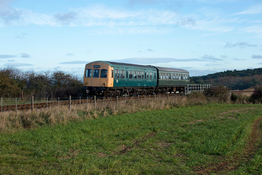 M51188 & M56352, 09.55 Sheringham-Holt, A149 Coast Road bridge 
 A class 101 DMU set formed of M51188 and M56352 cross over the A149 Coast Road bridge working the North Norfolk Railway's first train of the day, the 09.55 Sheringham to Holt. It is another superb autumn morning which brings with it some lovely lighting. 
 Keywords: M51188 M56652 09.55 Sheringham-Holt A149 Coast Road bridge