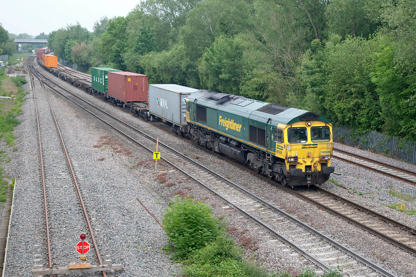 66508, 08.50 Crewe Basford Hall-Southampton (4O49), Godstow Bridge 
 Going at a walking pace, 66508 passes Godstow Bridge north of Oxford heading the 08.50 Crewe Basford Hall to Southampton Freightliner working. This 4O49 was fairly lightly loaded on this day as can be seen in this picture. There were some hints of an improvement in the grey weather with some breaking of the flat cloud to the west. Also, it had become very humid. To the left in this picture to new relief line can be seen. Despite it having been laid for quite sometime now, it has still yet to be commissioned. With the cancelling of the electrification to Oxford, I wonder if it will now be put to use? 
 Keywords: 66508 4O49 Godstow Bridge