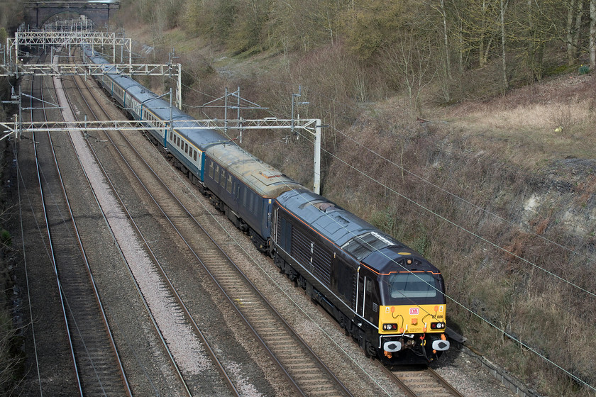 67006, 09.35 Burton Ot Wetmore-Wembley yard ECS, Hyde Road bridge 
 67006 'Royal Sovereign' leads a lovely set of Mk.II stock though Roade cutting spoilt only by the generator coach at the front. It was hauling the 09.35 Burton Ot Wetmore to Wembley yard ECS move. This stock was being taken south in connection with its use the next day on the The Somerset Strimmer railtour from Victoria to the East Somerset Railway. 
 Keywords: 67006 09.35 Burton Ot Wetmore-Wembley yard ECS Hyde Road bridge