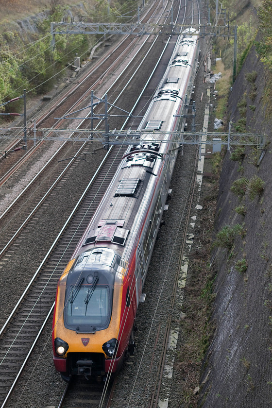 Class 221, VT 11.10 London Euston-Chester (1D85), Roade cutting 
 A class 221 heads north through Roade cutting working the 1D85 11.10 Euston to Chester. Despite it being mid-autumn, there is still enough light deep in the magnificent cutting to illuminate a train. 
 Keywords: Class 221 11.10 London Euston-Chester 1D85 Roade cutting