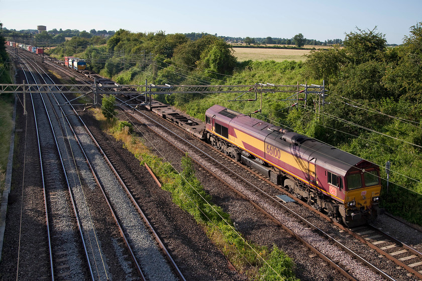 66100, 13.12 Trafford Park FLT-London Gateway (4L56), Victoria Bridge 
 Still wearing its old EWS livery but with DB branding, 66100 heads the 13.12 Trafford Park to London gateway Freightliner past Victoria Bridge on a superb summer's evening. 
 Keywords: 66100 13.12 Trafford Park FLT-London Gateway 4L56 Victoria Bridge