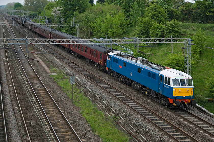 86259, outward leg of The Cumbrian Mountain Express, 06.26 London Euston-Carlisle, (1Z82), Victoria bridge 
 Unusually, The Cumbrian Mountain Express charter is running on a weekday rather than a Saturday. However, running to almost the same times meant that I could capture it before work making me just a little late. The 06.26 Euston to Carlisle is led, as usual, by 86259 'Les Ross/Peter Pan' seen passing Roade on the down fast line. The cloudy weather here in the south made way for a super late spring day 'up-north' later in the day with plenty of pictures posted online of LMS Princess Coronation Class 6233 'Duchess of Sutherland' leading the train with a particular favourite of mine to be found at...... https://www.flickr.com/photos/48612927@N08/8799723514/ 
 Keywords: 86259 The Cumbrian Mountain Express, 06.26 London Euston-Carlisle, 1Z82 Victoria bridge