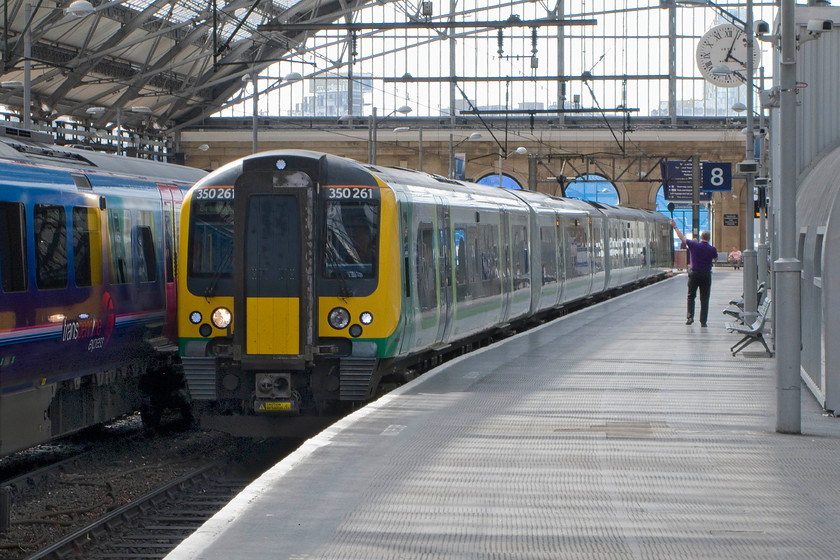 350261, LM 16.04 Liverpool Lime Street-Birmingham New Street (1L79), Liverpool Lime Street station 
 According to the clock, the dispatcher is spot on getting the 16.04 away from Liverpool LImes Street to Birmingham New Street. London Midland's 350261 will take about an hour and a half to get to Birmingham where it will terminate at platform 4C. This image shows the grandeur of the front arch of Lime Street station contributing to it being one of the UK's most impressive stations. 
 Keywords: 350261 16.04 Liverpool Lime Street-Birmingham New Street (1L79), Liverpool Lime Street station London Midland Desiro