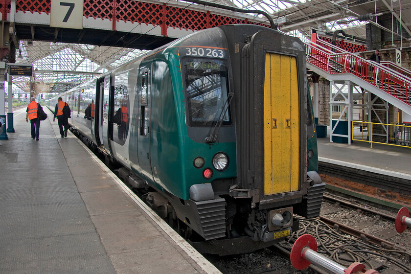 350263 & 350261, LN 12.33 Crewe-London Euston (1U30, 8L), Crewe station 
 By contrast to the two-car train that we had just taken from Chester to Crewe that was absolutely packed the eight-car Class 350 was virtually empty! In fact, it stayed pretty empty for the duration of the journey that we took on it from Crewe to Milton Keynes. 350263 is seen on the stops with 350261 leading at the front as the crew walk down ready to work the 1U30 12.33 to Euston service. 
 Keywords: 350263 350261 12.33 Crewe-London Euston 1U30 Crewe station London Northwestern Desiro