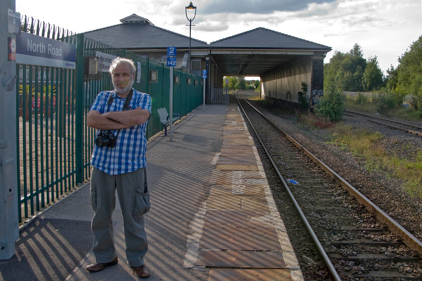 Andy, Darlington North Road station 
 The final photograph of our epic two-day trip sees Andy standing on Darlingtons North Road station platform. In the background is the 1842 train shed that is Grade II listed. It is no longer used as part of Network Rail and Northerns station but being part of the Head of Steam museum that occupies the former goods shed to the left. All that is left for us now is to make for home in Andy's Micra, a fair way from here in the northeast to Northamptonshire! 
 Keywords: Andy Darlington North Road station