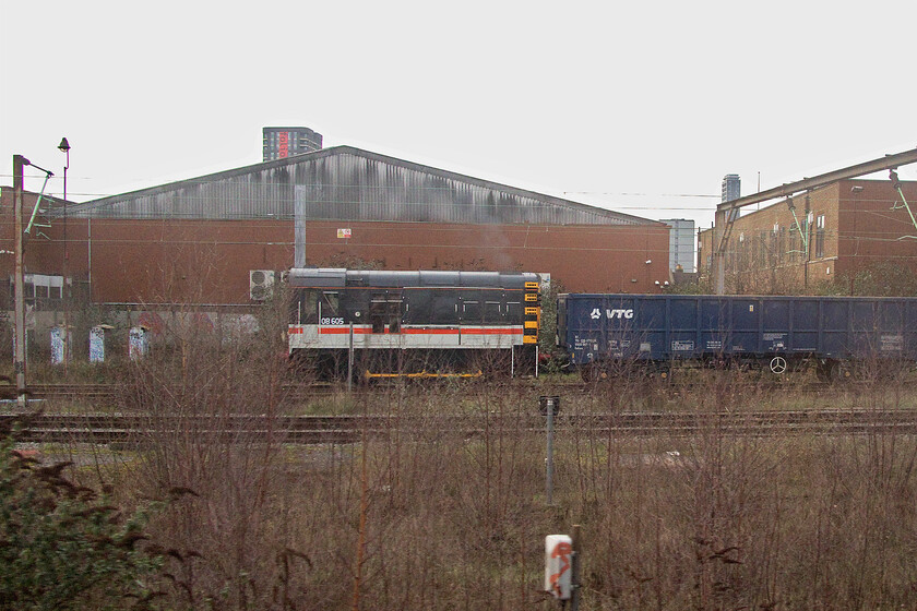 08605, shunting, Euro Terminal sidings 
 Somebody has a sense of humour! 08605 wearing its Intercity Executive livery is seen shunting and moving wagons around in the Euro Terminal sidings. With a maximum speed of twenty miles per hour, the 1959-built shunter would never have lived up to it's livery's expectations! 
 Keywords: 08605 shunting Euro Terminal sidings Intercity Executive