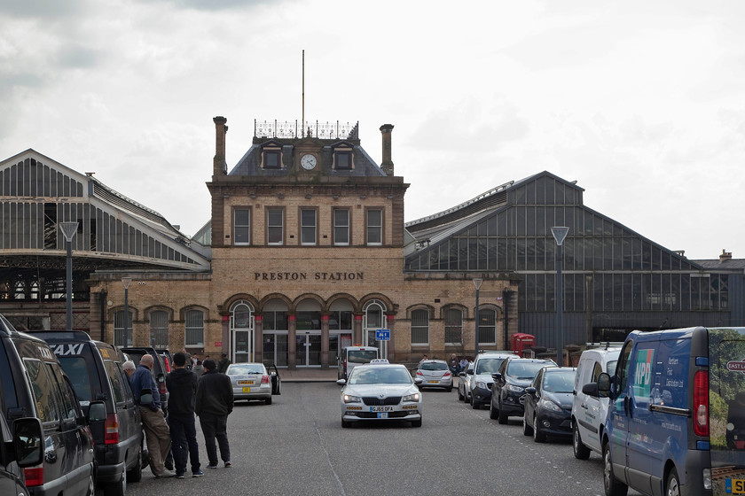 Frontage, Preston Station 
 Without the name above the doors and the UK registered cars, this station frontage could be somewhere in Europe! The North Union Railway opened a station at Preston historically very early in 1838. This building was opened in 1890 taking its style from some sort of French Chateaux by the look of it! 
 Keywords: Frontage, Preston Station