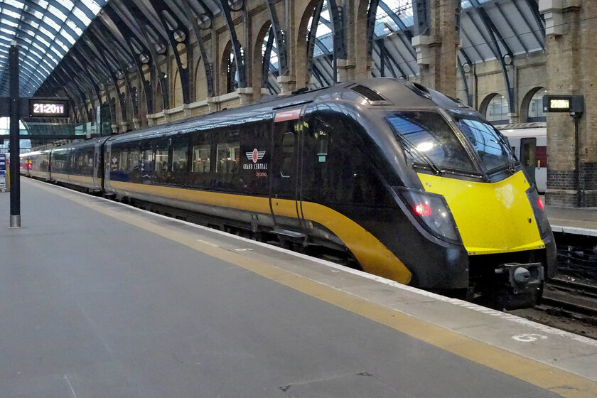 180102, GC 21.23 London King's Cross-Ferme Park (5Y61, 1E), London King's Cross station 
 Having just arrived from Sunderland 180102 has emptied itself of passengers and is being prepared to run as 5Y61 to Ferme Park for overnight servicing. Grand Central has persevered with the notoriously unreliable Class 180s and they seem to be working well for them now. Of the original fourteen sets, just ten are still in service being now well over twenty years old. 
 Keywords: 180102 21.23 London King's Cross-Ferme Park 5Y61 London King's Cross station Grand Central