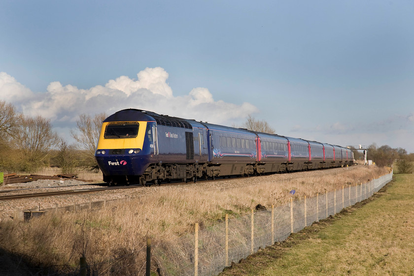 43198, GW 14.00 London Paddington-Bristol Temple Meads (1C17), Ashbury crossing SU246878 
 HST power car 43198 was a late delivery being built in 1982 as part of a final and additional batch of sets to supplement the Eastern Region allocation. Initially, it was part of set 254036, the highest-numbered power car. Now earning its keep on the Western Region, it is seen passing Ashbury in West Oxfordshire under a lovely winter sky with the 14.00 Paddington to Bristol Temple Meads. Note the recently installed 'soft' fencing in the foreground, that compares very favourably with the more commonly installed 'hard' palisade type. 
 Keywords: 43198 14.00 London Paddington-Bristol Temple Meads 1C17 Ashbury crossing SU246878