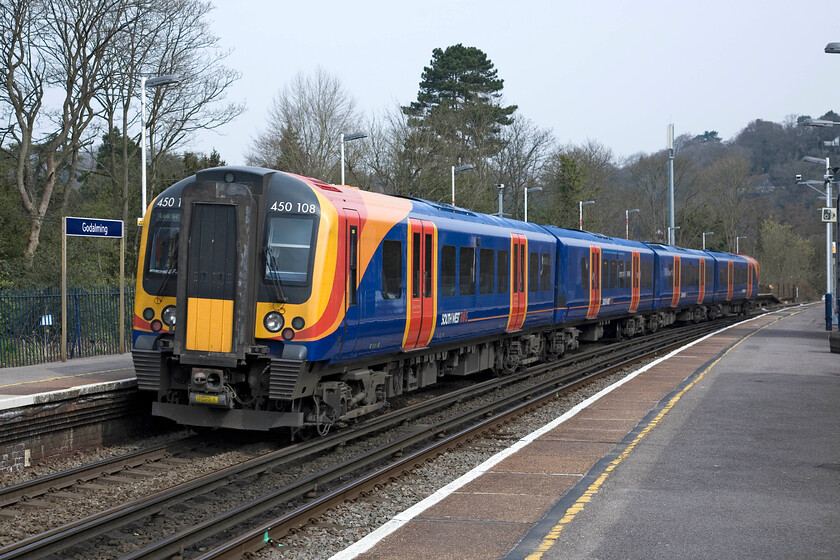 450108, SW 10.24 Portsmouth & Southsea-London Waterloo, Godalming station 
 The 10.24 Portsmouth and Southsea to London Waterloo SWT service leaves Godalming station worked by Desiro 450108. The Class 450s have been in service for ten years now and have become the mainstay of operations on this route and a number of others throughout the south of England. 
 Keywords: 450108 10.24 Portsmouth & Southsea-London Waterloo Godalming station SWT South West Trains Desiro