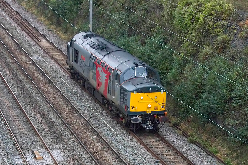 37884, 12.38 Long Marston-Willesden TMD (0Q73, RT), Hyde Road bridge 
 37884 'Cepheus' passes light engine through Roade cutting working the 0Q73 12.38 Long Marston to Willesden TMD light engine move. This was originally timetabled to run as 5Q73 towing a stored Class 730 to London ready to enter service. However, for some reason, the move was cancelled with the ROG Class 37 already at the Worcestershire storage facility. 
 Keywords: 37884, 12.38 Long Marston-Willesden TMD (0Q73, RT), Hyde Road bridge ROG Rail Operations Group	Cepheus