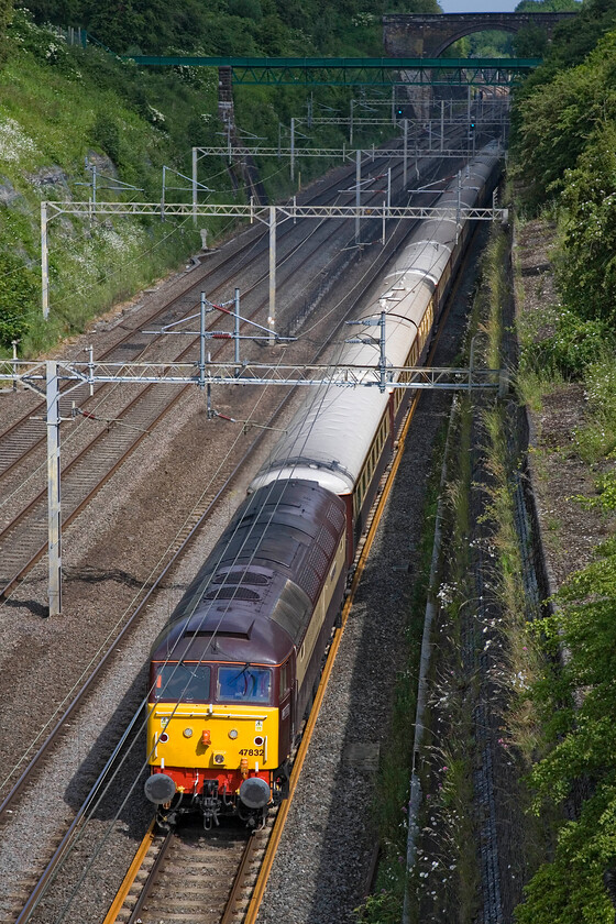 47832, return leg of Northern Belle GP Special, London Euston-Northampton-Willesden (1Z35), Roade cutting 
 47832 'Solway Princess' leads the returning London Euston to Northampton empty coaching stock back to Willesden running as 1Z35. Racegoers making for the F1 Grand Prix at Silverstone enjoyed a champagne breakfast run down from London earlier and have now alighted at Northampton for a bus transfer to Silverstone. I was lucky with the sun (for once!) on this occasion with the front in full light with the rear of the train in shadow. 
 Keywords: 47832 Northern Belle GP Special London Euston-Northampton-Willesden 1Z35 Roade cutting Solway Princess