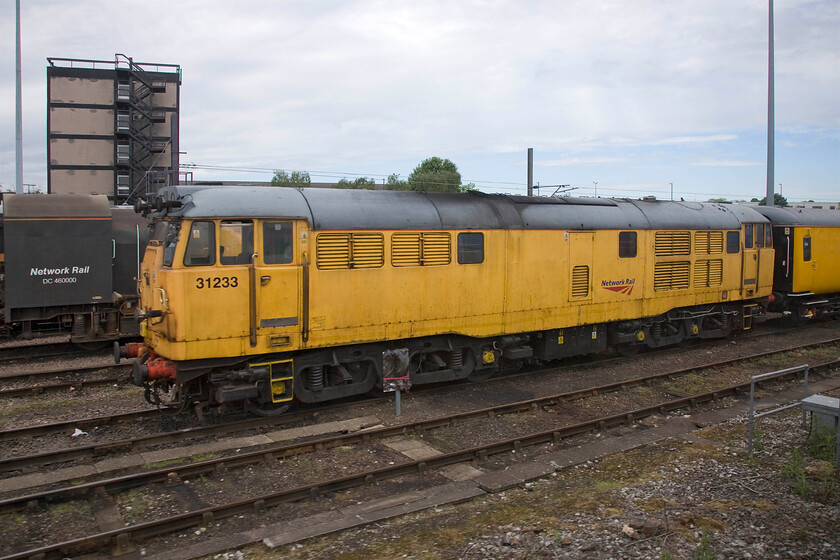 31233, stabled, Derby REVL 
 Now looking a little tatty in its tired Network Rail yellow paintwork 31233 stands stabled at Derby REVL. As NR attempts to modernise its stock the future of the yellow Class 31 is uncertain but I suspect that preservation will beckon for the veteran locomotives with this one dating from October 1960. 
 Keywords: 31233 stabled Derby REVL