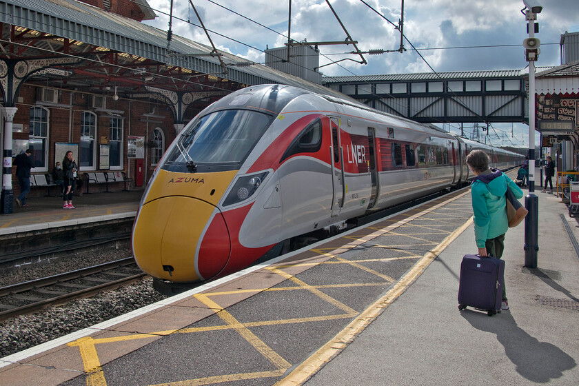 801216, GN 09.56 Peterborough-York (1N81, RT), Grantham station 
 LNER Azuma 801216 arrives at Grantham station working the 1N18 09.56 Peterborough to York LNER service. We travelled on the same service just over a month ago and it was noticeable that there were significantly more passengers this time as travelling begins to pick up a little as the COVID restrictions are eased and infection rates continue to decline. However, do not get me wrong, the numbers on trains remain a fraction of 'normal' whatever that was prior to March 2020! 
 Keywords: 801216 09.56 Peterborough-York 1N81 Grantham station LNER Azuma