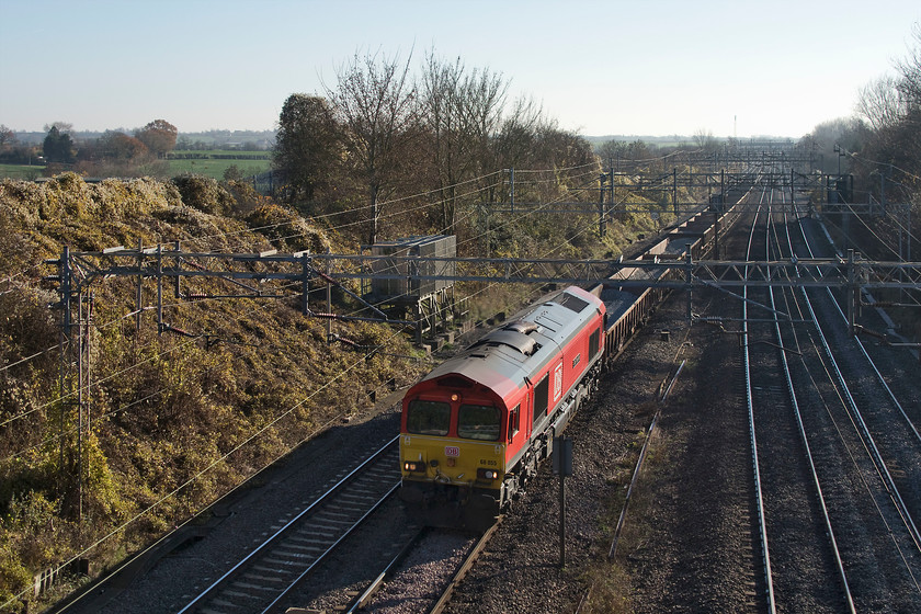 66055, 10.41 Hanslope Junction-Bescot Up Engineers Sidings, Victoria bridge 
 Following on from a number of sets of overnight engineering works there were a series of infrastructure trains on this Sunday morning. 66055 'Alain Thauvette' leads a train of partially full ballast wagons past Victoria bridge with the 10.41 Hanslope Junction to Bescot. The 66 is named after the French Canadian Alain Thauvette, who for a long time led Euro Cargo Rail (ECR), the French subsidiary of Deutsche Bahn. He has since moved to work for SNCF. 
 Keywords: 66055 10.41 Hanslope Junction-Bescot Up Engineers' Sidings Victoria bridge