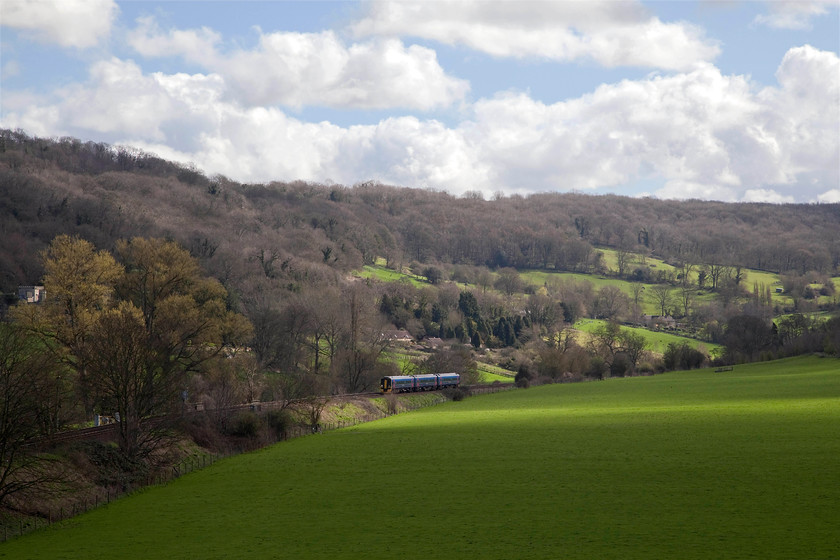 Class 158, GW 08.59 Brighton-Great Malvern (1V94, RT), Avon Valley ST782652 
 I took this shot deliberately early in an effort to try and get one train in the sun! I'm not too worried though because the vista is so superb! An unidentified class 158 heads through the Avon Valley on the approach to Bathampton Junction working the 08.59 Brighton to Great Malvern. The lush greenery of the ground cover contrasts with he brown trees that are just beginning to develop their buds. 
 Keywords: Class 158 1V94 Avon Valley ST782652